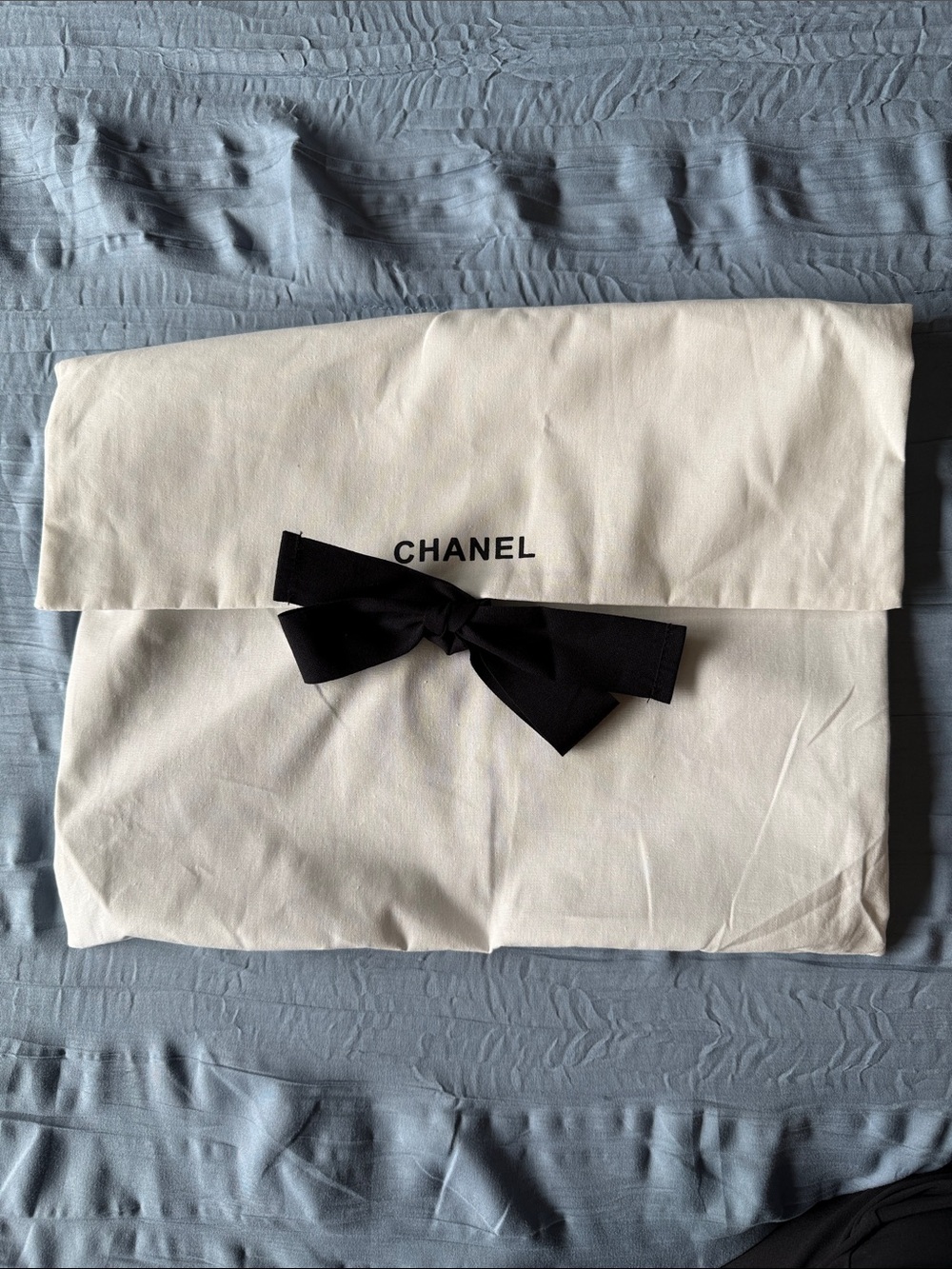 CHANEL Cream Dust Bag with Black Bow Logo